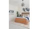 Stylish bedroom featuring a starburst light fixture and unique wall decor at 19834 W 56Th Pl, Golden, CO 80403