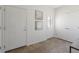 Entryway with tiled floors, art and several doors at 19834 W 56Th Pl, Golden, CO 80403