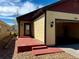 Charming exterior view of a single-story home, showcasing the front entrance, garage and neat landscaping at 19834 W 56Th Pl, Golden, CO 80403