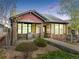 Beautiful home with a well-kept lawn, inviting front porch, and stone facade at 19834 W 56Th Pl, Golden, CO 80403