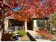 Charming single-story home featuring stone accents, a cozy porch, and vibrant fall foliage for added curb appeal at 19834 W 56Th Pl, Golden, CO 80403