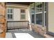 Cozy front porch with stone accents, decorative lighting, and ample natural light at 19834 W 56Th Pl, Golden, CO 80403