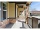 Charming front porch showcasing stone details, an inviting entrance, and outdoor decor at 19834 W 56Th Pl, Golden, CO 80403