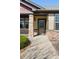 Welcoming front porch featuring stone columns, a seating area, and a charming entrance at 19834 W 56Th Pl, Golden, CO 80403