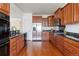 Kitchen with wood cabinets, stainless steel appliances, and granite countertops at 19834 W 56Th Pl, Golden, CO 80403