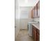 Laundry room features tiled floors, cabinets, washer and sink at 19834 W 56Th Pl, Golden, CO 80403
