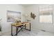 Office featuring a large modern desk, lots of natural light, and a neutral paint color at 19834 W 56Th Pl, Golden, CO 80403