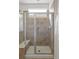 Modern tiled shower with glass door and built-in bench at 19834 W 56Th Pl, Golden, CO 80403