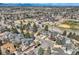 Expansive aerial view showcases the neighborhood, nearby school, and mountain views at 6651 Yale Dr, Highlands Ranch, CO 80130