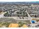 Aerial shot of a neighborhood with well-maintained houses and tree-lined streets at 6651 Yale Dr, Highlands Ranch, CO 80130