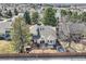 Aerial view of a home's backyard with a wooden fence for privacy at 6651 Yale Dr, Highlands Ranch, CO 80130