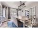 Bright dining area featuring a stylish light fixture, large windows, and comfortable seating at 6651 Yale Dr, Highlands Ranch, CO 80130
