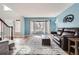 Bright living room with large windows, hardwood floors, and comfortable seating area at 6651 Yale Dr, Highlands Ranch, CO 80130