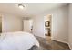 Spacious bedroom with neutral colors and plush carpeting provides a comfortable living space at 145 S Buchanan Ave, Louisville, CO 80027