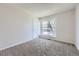 Bedroom featuring a large window and neutral walls offers ample natural light and a peaceful atmosphere at 145 S Buchanan Ave, Louisville, CO 80027