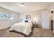 Cozy bedroom with a large window and neutral decor offers a relaxing retreat at 145 S Buchanan Ave, Louisville, CO 80027