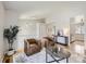 Second-floor landing with hardwood floors, a cozy seating area with two brown armchairs and neutral decor at 145 S Buchanan Ave, Louisville, CO 80027