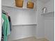 Walk-in closet with multiple shelves and hanging rods provide ample storage at 12054 E Lake Cir, Greenwood Village, CO 80111