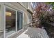 Outdoor deck and patio area with sliding glass door access at 12054 E Lake Cir, Greenwood Village, CO 80111