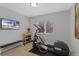 Exercise room with treadmill, bench and TV for the fitness enthusiast at 12054 E Lake Cir, Greenwood Village, CO 80111