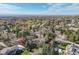 Panoramic aerial view of the suburban neighborhood highlighting the lush landscape and mountain views at 4 Brookside Dr, Greenwood Village, CO 80121