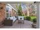 Covered back patio with comfortable outdoor seating, perfect for entertaining at 4 Brookside Dr, Greenwood Village, CO 80121