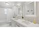 Bright bathroom with double sinks and bathtub with shower at 4 Brookside Dr, Greenwood Village, CO 80121