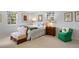 Spacious bedroom with a queen-sized bed, two chairs, and multiple windows at 4 Brookside Dr, Greenwood Village, CO 80121
