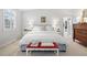 Cozy main bedroom with a plush bed, neutral tones, and natural light at 4 Brookside Dr, Greenwood Village, CO 80121