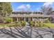 Charming two-story home with landscaped yard, covered porch, and beautiful architectural details at 4 Brookside Dr, Greenwood Village, CO 80121