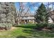 Charming two-story home featuring a landscaped yard and inviting front porch, perfect for enjoying the outdoors at 4 Brookside Dr, Greenwood Village, CO 80121