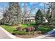 A lovely home on a large lot with an expansive yard surrounded by mature trees and lush landscaping at 4 Brookside Dr, Greenwood Village, CO 80121