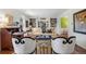 Bright living room with a bay window, built-in bookshelves and stylish decor at 4 Brookside Dr, Greenwood Village, CO 80121