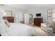 Spacious main bedroom with wooden floors and neutral tones at 4 Brookside Dr, Greenwood Village, CO 80121