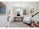 Bright home office with classic wainscoting, desk, and comfortable chair at 4 Brookside Dr, Greenwood Village, CO 80121