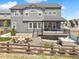 Back exterior view with deck, hot tub and fire pit seating area at 3038 Blithe Pt, Castle Rock, CO 80108