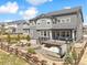 Spacious backyard featuring a patio with a fire pit, a deck with a grill, and a hot tub at 3038 Blithe Pt, Castle Rock, CO 80108