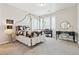Bedroom featuring a four-poster bed, a piano, and a vanity with a round mirror at 3038 Blithe Pt, Castle Rock, CO 80108