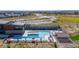 Community pool with cabana and lounge seating offers residents a modern space to enjoy the outdoors at 3038 Blithe Pt, Castle Rock, CO 80108