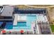 The community pool is well appointed with lounge chairs, tables, and a built in cabana at 3038 Blithe Pt, Castle Rock, CO 80108