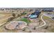 Aerial view of community pool and playground; great for families and entertaining in a modern setting at 3038 Blithe Pt, Castle Rock, CO 80108