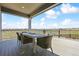 Covered deck featuring a table and chairs with great views of the surrounding landscape and community at 3038 Blithe Pt, Castle Rock, CO 80108
