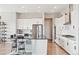Modern kitchen boasting stainless steel appliances, sleek countertops, and a spacious island with seating at 3038 Blithe Pt, Castle Rock, CO 80108