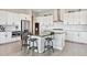 Modern kitchen boasting stainless steel appliances, sleek countertops, and a spacious island with seating at 3038 Blithe Pt, Castle Rock, CO 80108