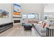 Cozy living room boasts a modern fireplace, plush sectional sofa, and plenty of natural light at 3038 Blithe Pt, Castle Rock, CO 80108