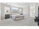 Spacious bedroom featuring large windows, and neutral tones creating a serene and inviting atmosphere at 3038 Blithe Pt, Castle Rock, CO 80108