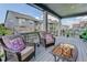 Relaxing covered patio with wicker furniture at 8901 S Ukraine Ct, Aurora, CO 80016