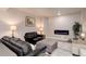 Finished basement recreation area with fireplace and seating at 8901 S Ukraine Ct, Aurora, CO 80016