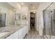 Spa-like bathroom with double vanity and large shower at 8901 S Ukraine Ct, Aurora, CO 80016