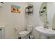 Small bathroom with pedestal sink and stylish decor at 8901 S Ukraine Ct, Aurora, CO 80016